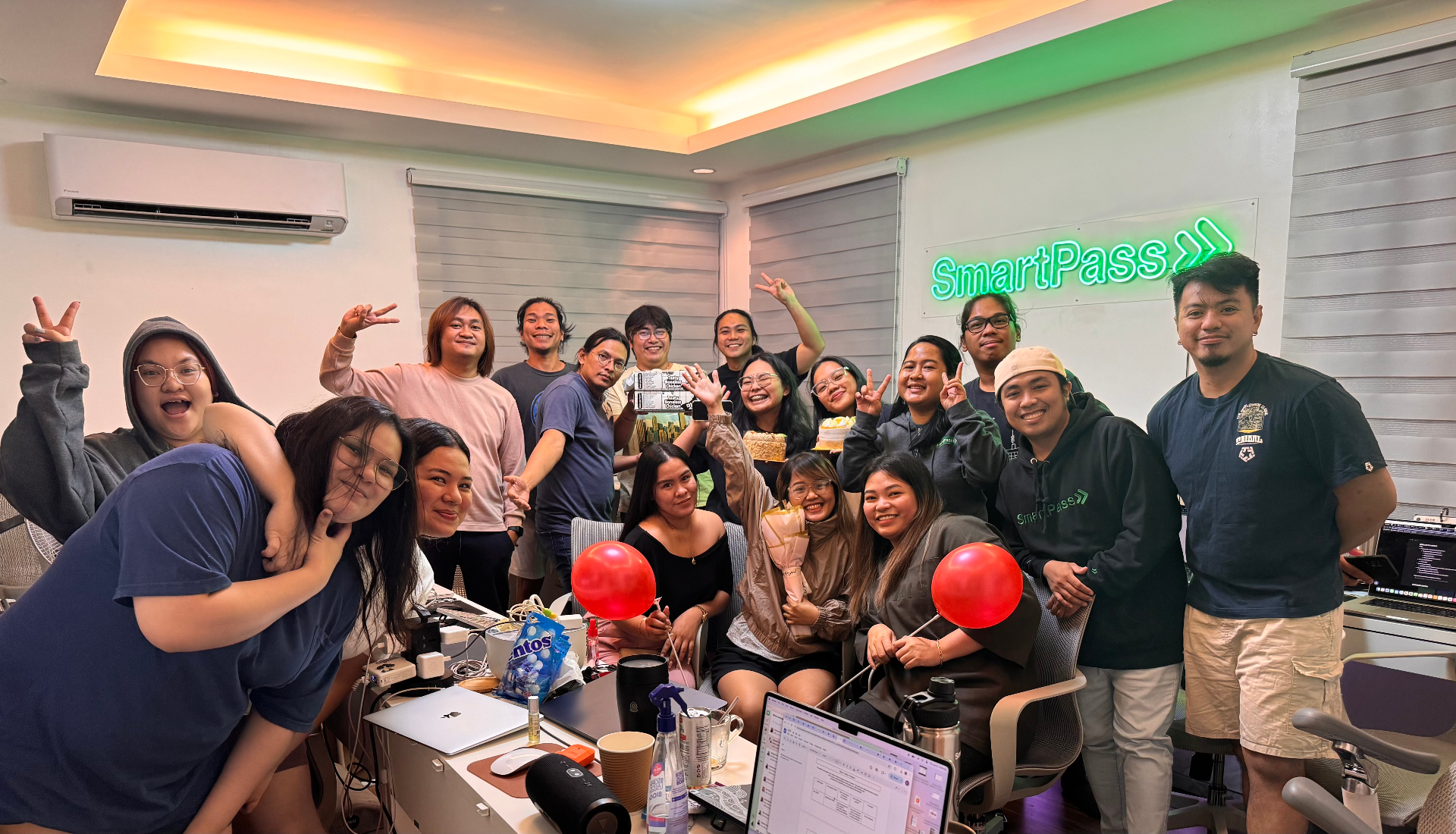 SmartPass team celebrating a milestone in the office